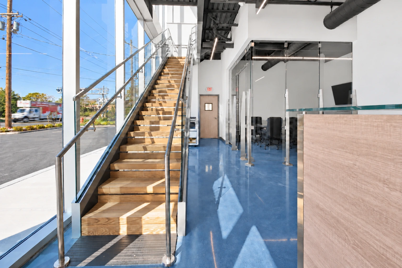 Glass staircase and metal handrails